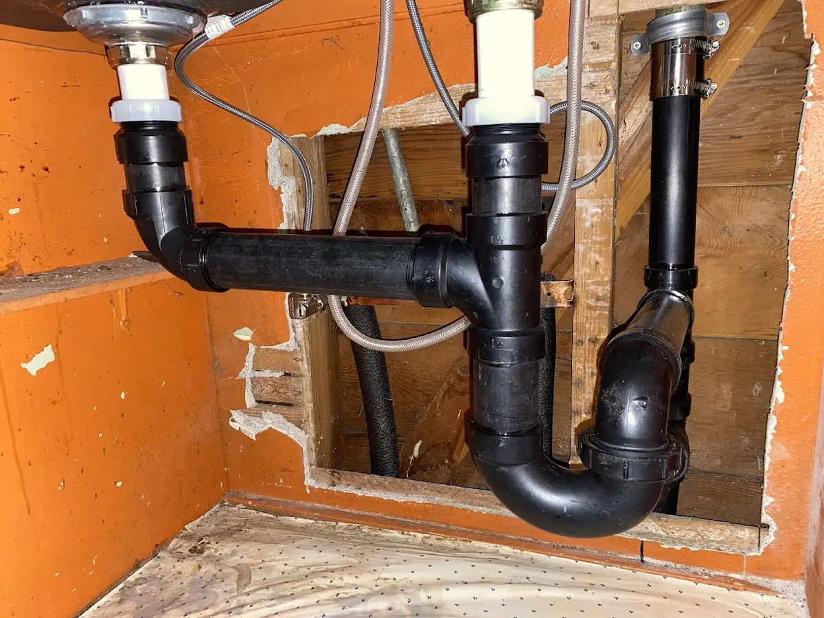 Professional Garbage Disposal Repair equipment and tools on the job in Prichard